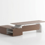 Aura Executive L-Shaped Desk with Sliding Storage in premium wood grain finish, perfect for modern professional offices.