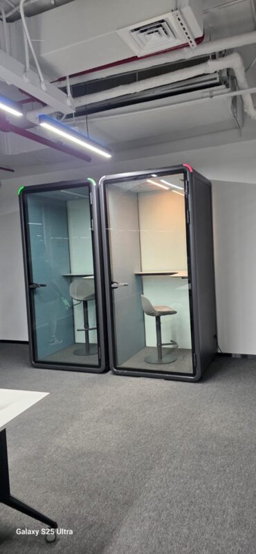 Two acoustic office phone booths installed in a UAE workplace